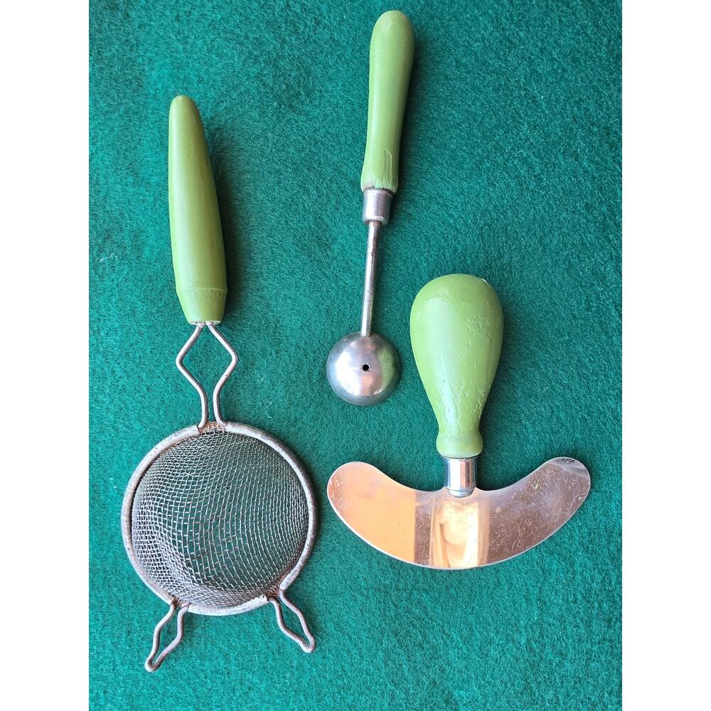 Vintage kitchen utensils green handle cutter, tea strainer and cherry  piter